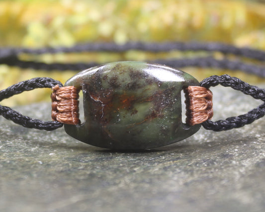Adjustable cord bracelet with Rimu Pounamu