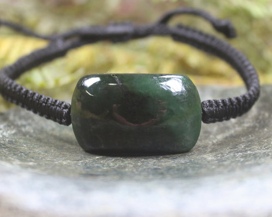 Adjustable cord bracelet with Rimu Pounamu