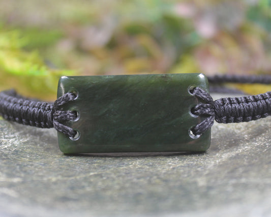 Adjustable cord bracelet with Rimu Pounamu