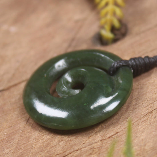 Koru pendant carved from Kawakawa Pounamu - NZ Greenstone
