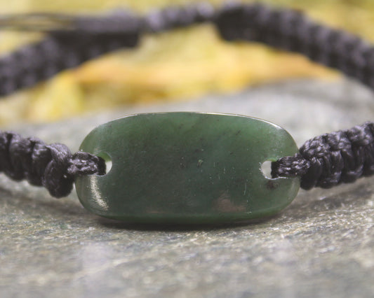 Adjustable cord bracelet with Kawakawa Pounamu