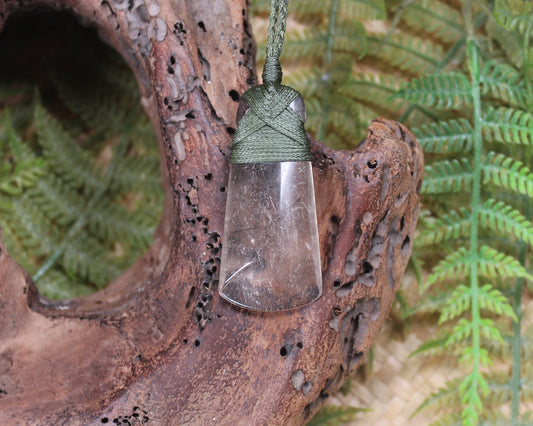 Toki pendant carved from Smokey Quartz