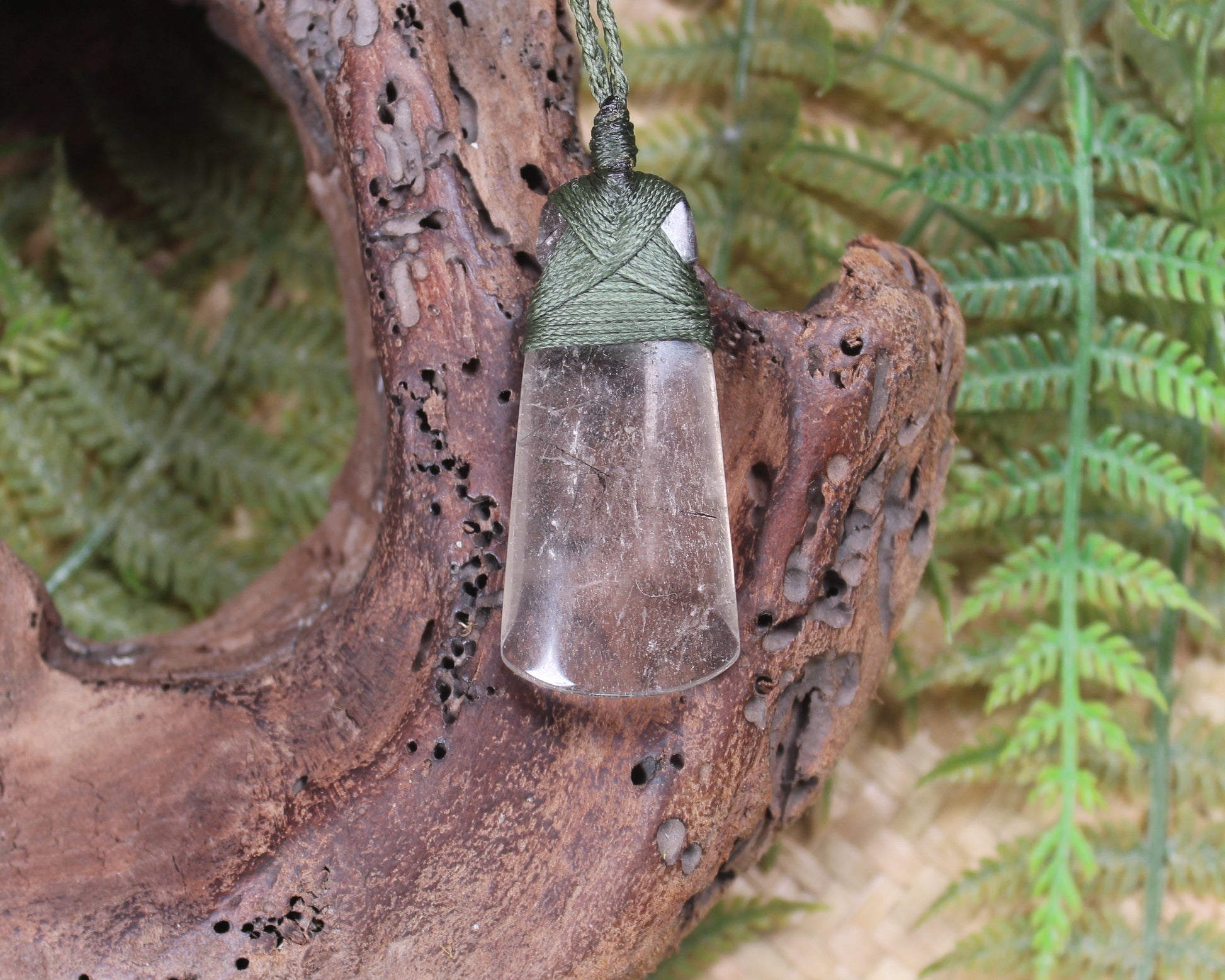 Toki pendant carved from Smokey Quartz