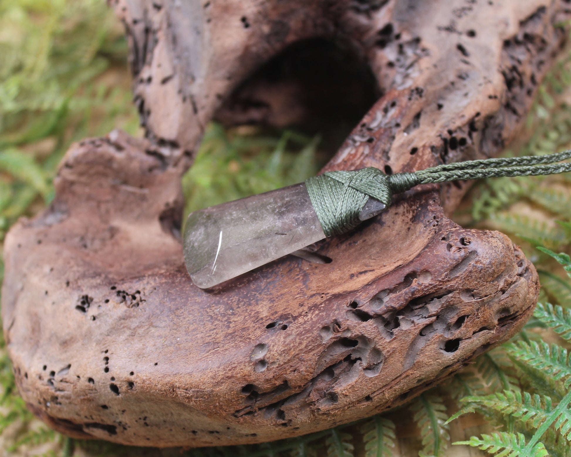 Toki pendant carved from Smokey Quartz