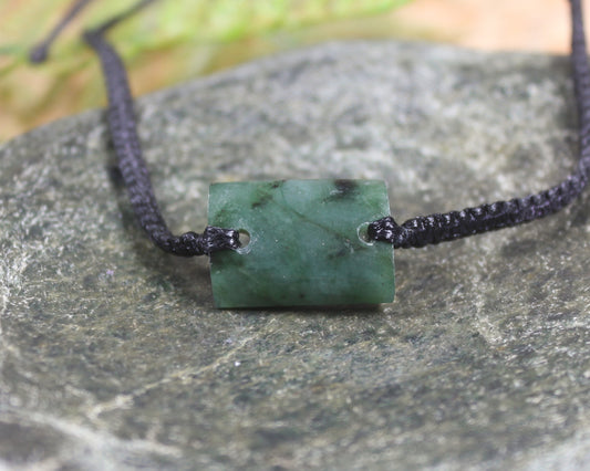 Adjustable cord bracelet with Rimu Pounamu