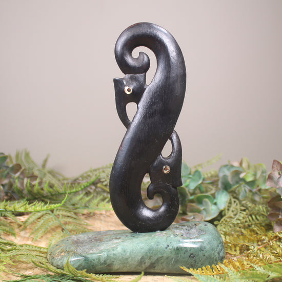 Manaia sculpture carved from recycled wood