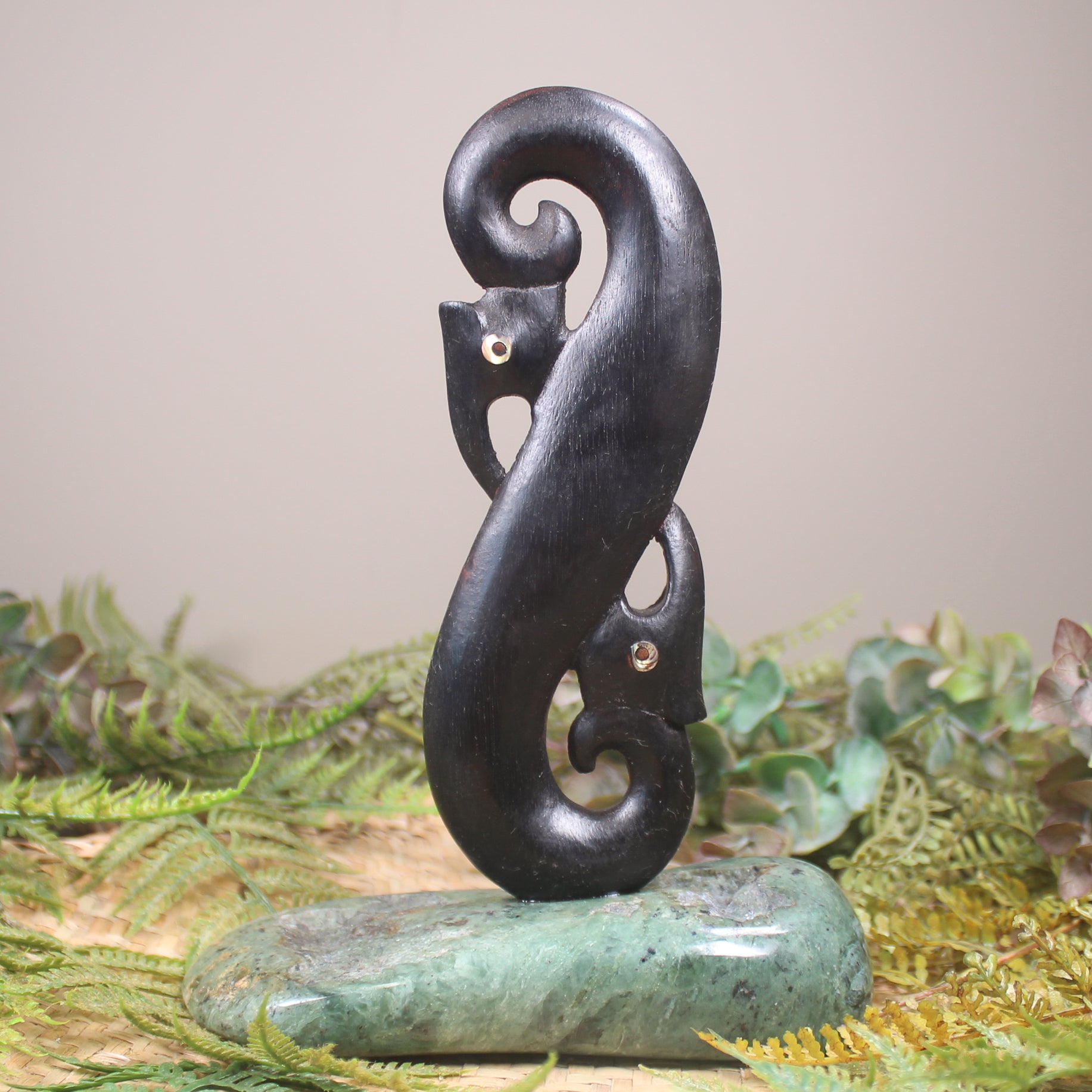 Manaia sculpture carved from recycled wood