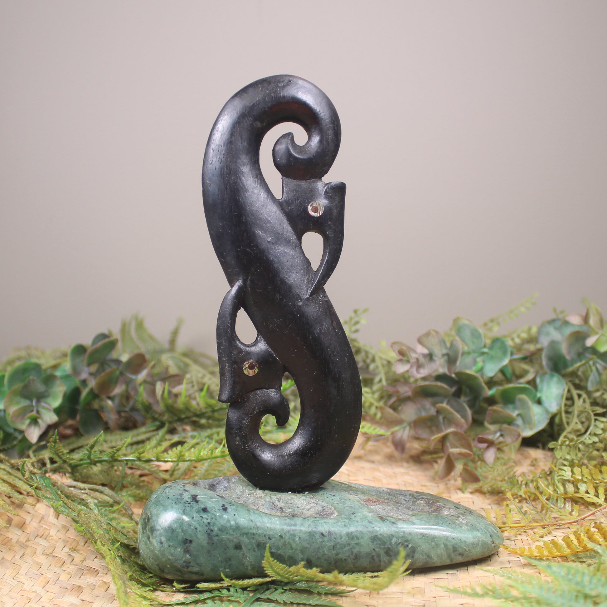 Manaia sculpture carved from recycled wood