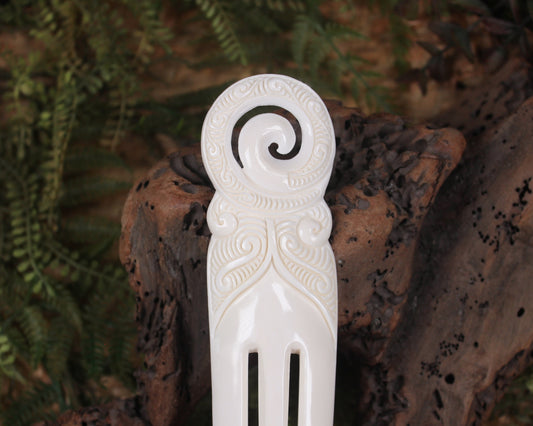 Heru with Koru carved from beef bone