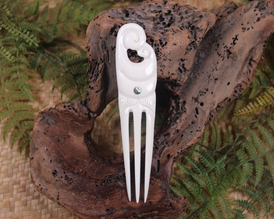 Heru with Koru carved from beef bone