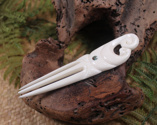 Heru with Koru carved from beef bone