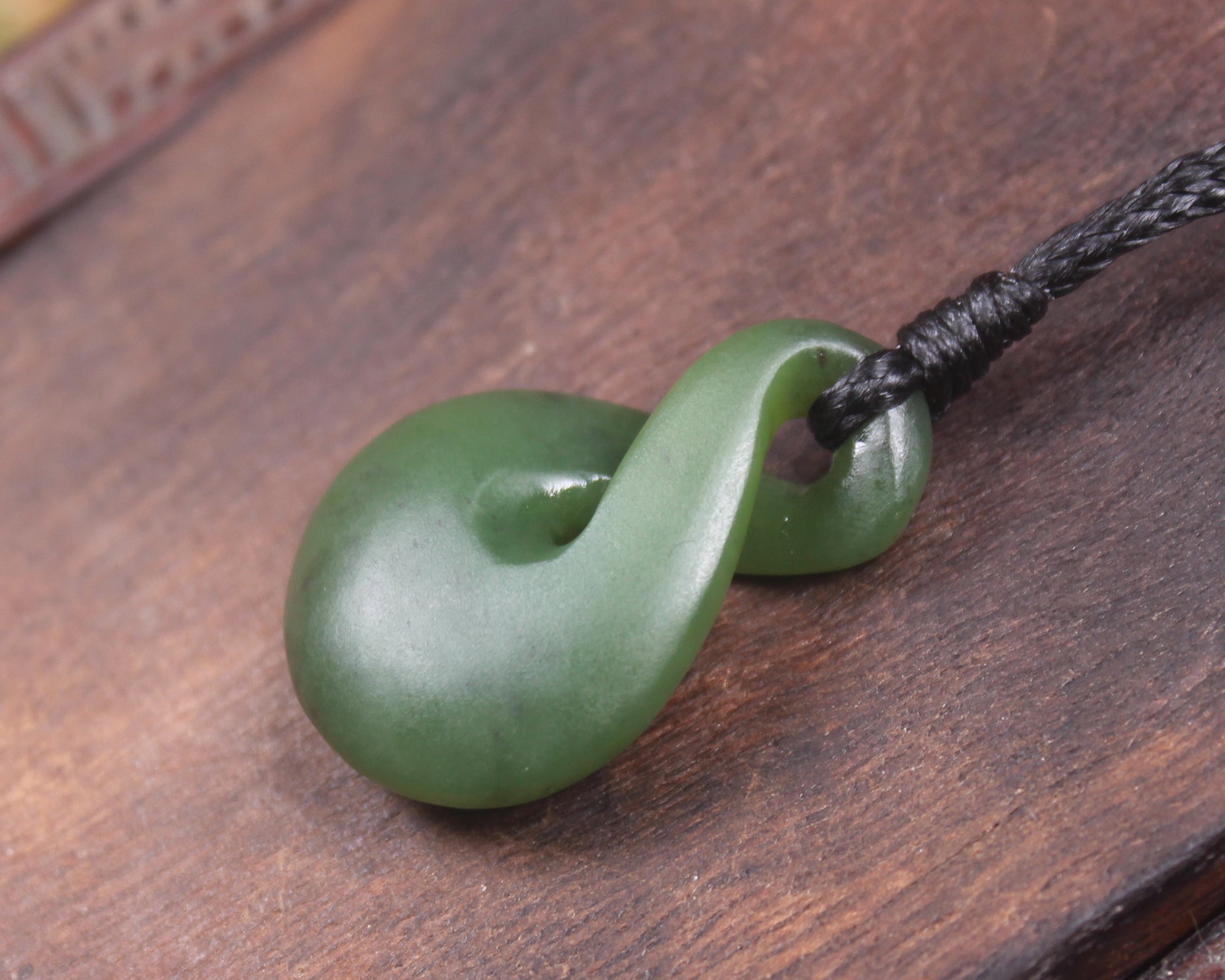 Twist or Pikorua carved from Hapopo Pounamu - NZ Greenstone