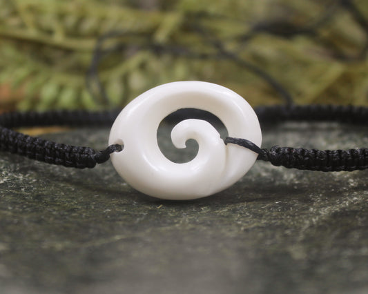 Adjustable cord bracelet with bone pendant