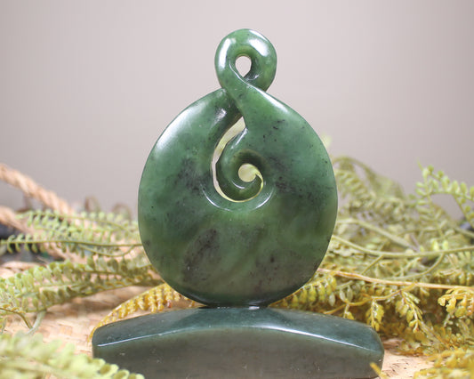 Hapopo Pounamu Koru Twist set on a Pounamu base - NZ Greenstone