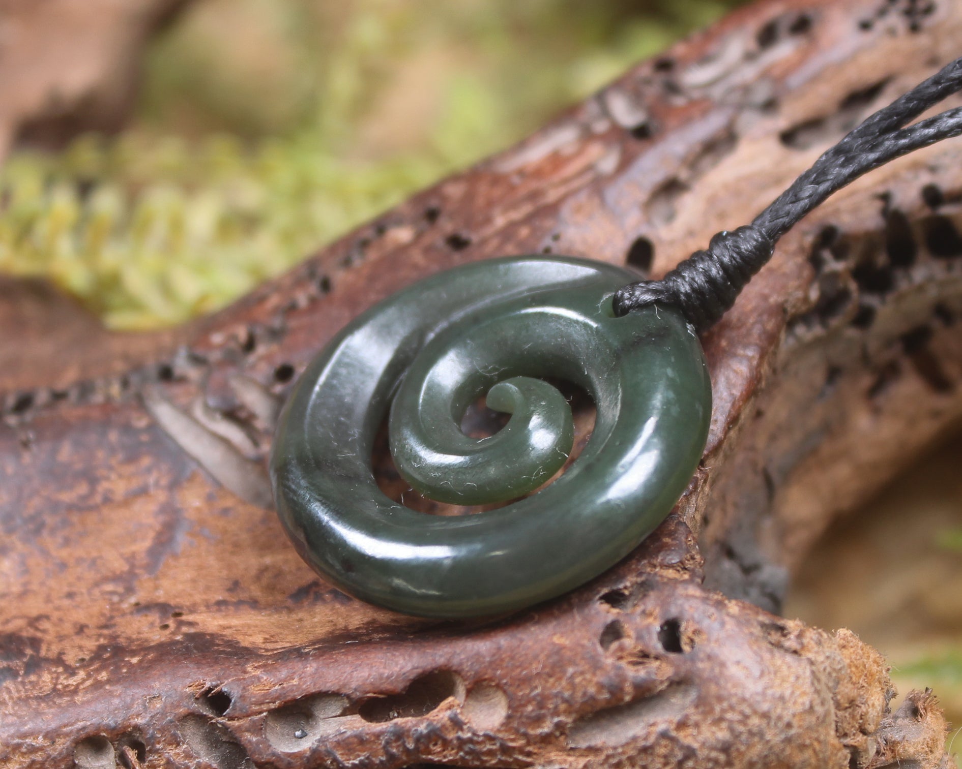 Koru pendant carved from Kawakawa Pounamu - NZ Greenstone