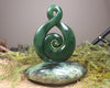 Kawakawa Pounamu Koru Twist set on a Pounamu base - NZ Greenstone