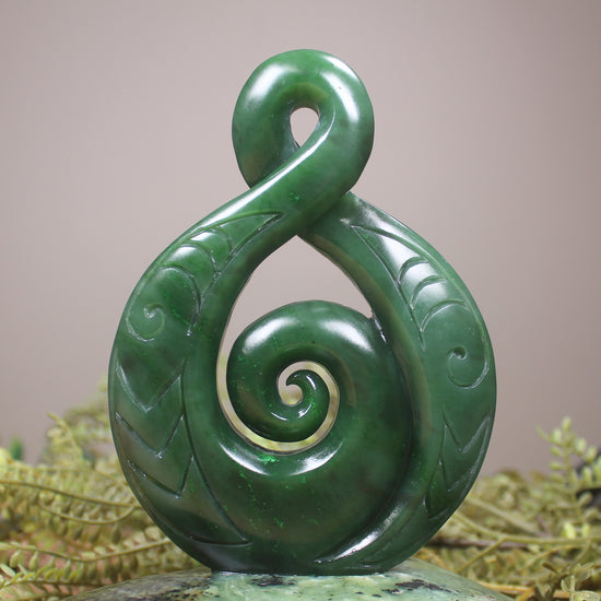 Kawakawa Pounamu Koru Twist set on a Pounamu base - NZ Greenstone