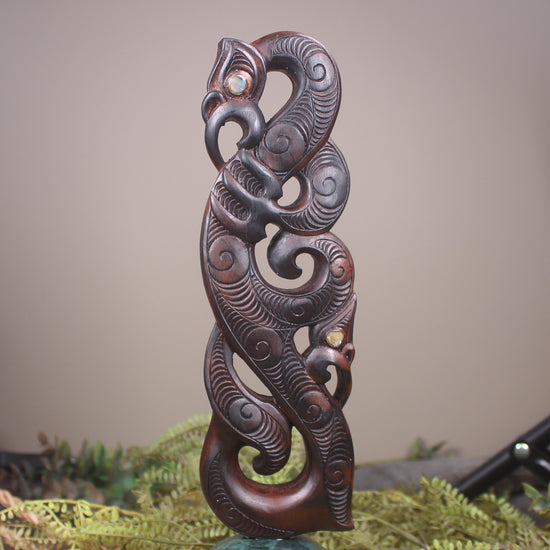 Manaia sculpture carved from recycled wood