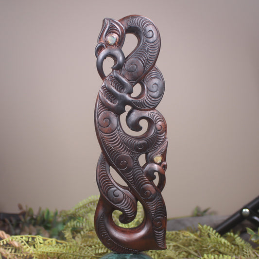Manaia sculpture carved from recycled wood