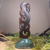 Manaia sculpture carved from recycled wood