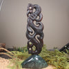 Manaia sculpture carved from recycled wood