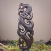 Manaia sculpture carved from recycled wood