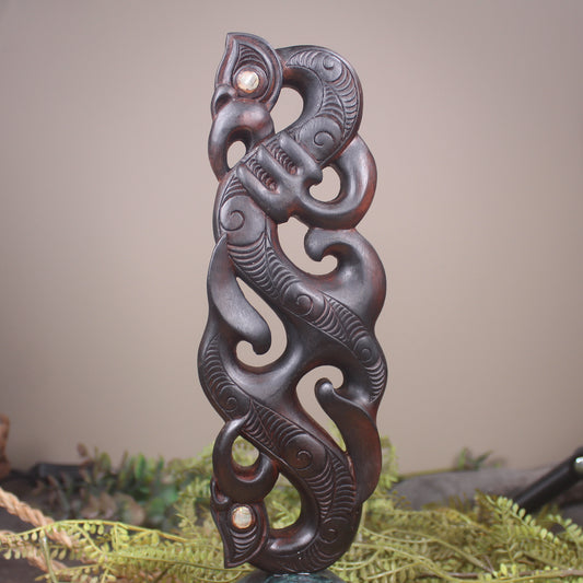 Manaia sculpture carved from recycled wood