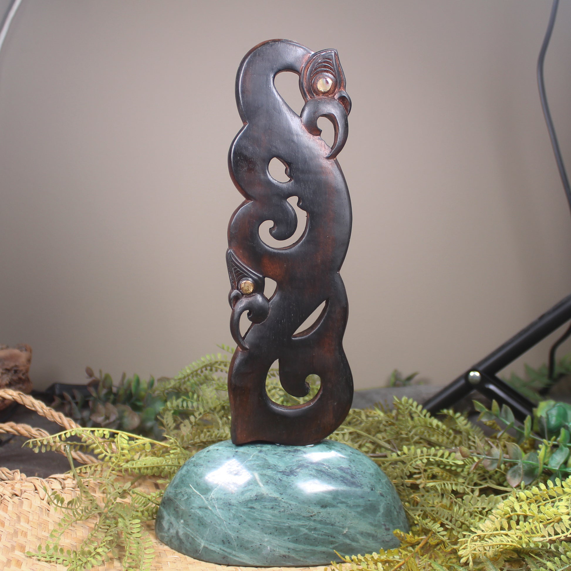 Manaia sculpture carved from recycled wood