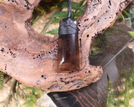 Toki pendant carved from Smokey Quartz