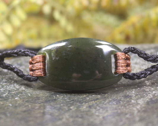 Adjustable cord bracelet with Rimu Pounamu