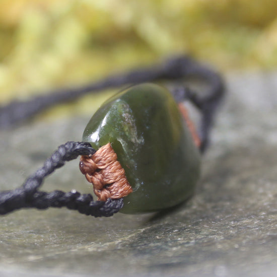 Adjustable cord bracelet with Rimu Pounamu