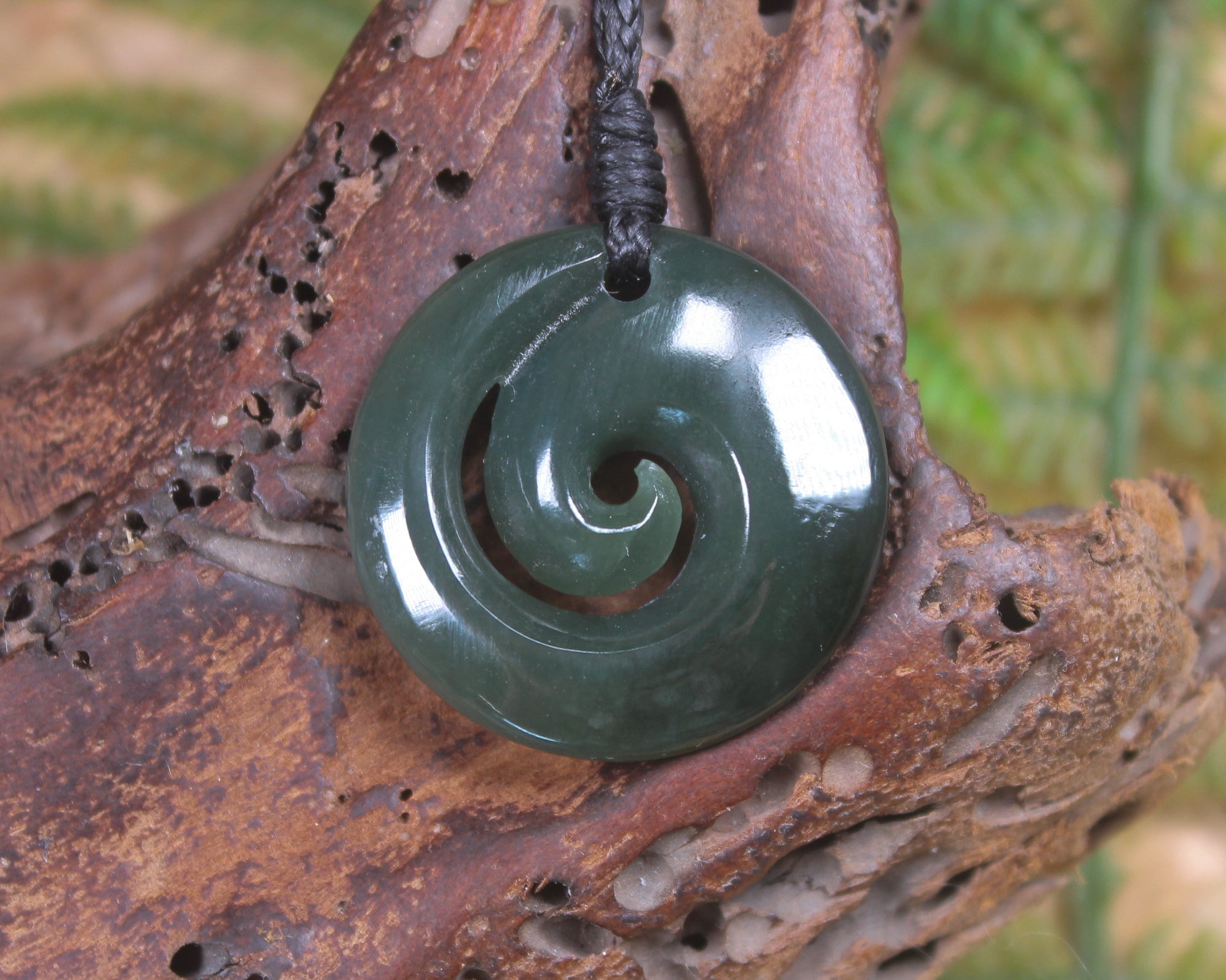 Koru pendant carved from Inanga Pounamu - NZ Greenstone