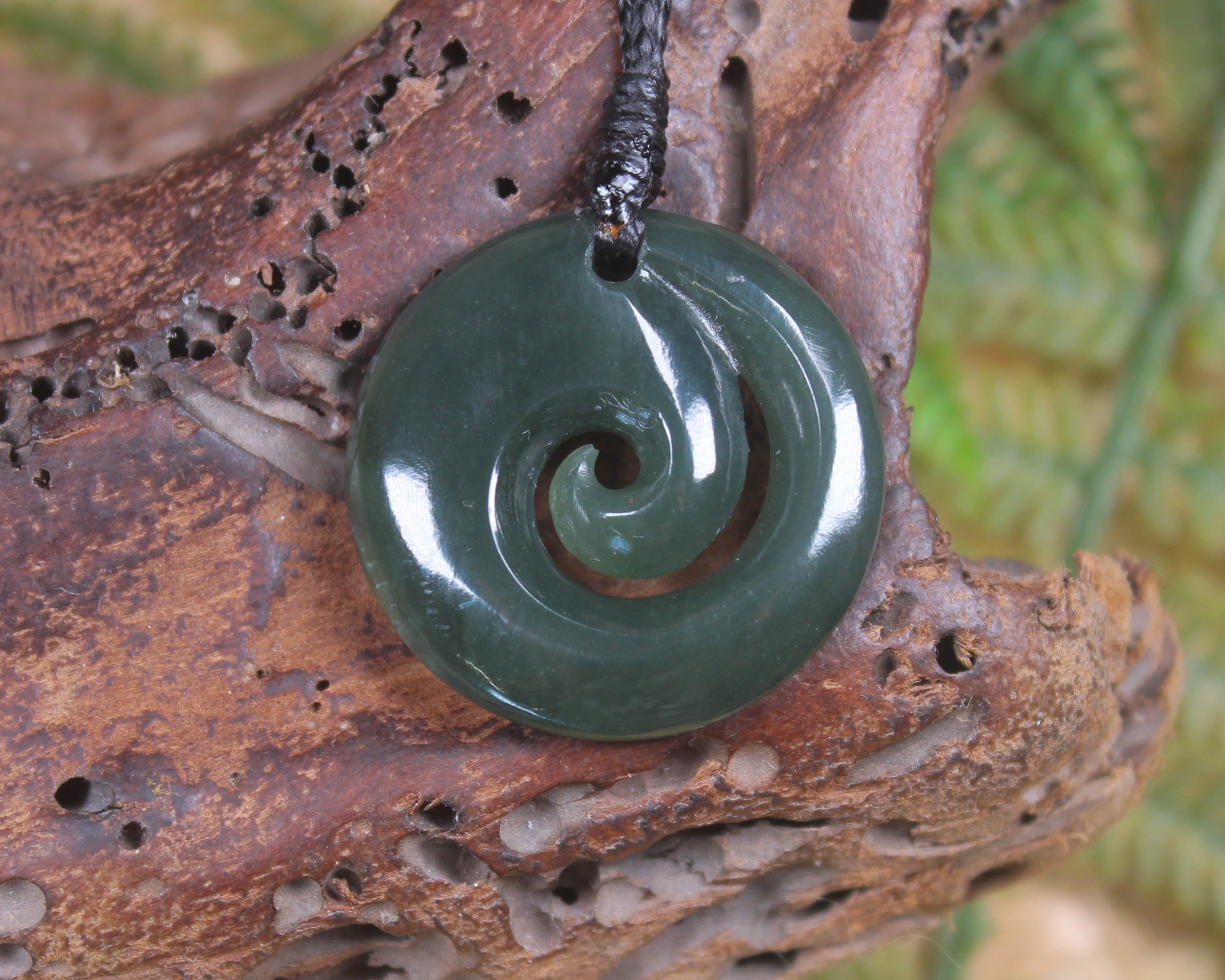 Koru pendant carved from Inanga Pounamu - NZ Greenstone