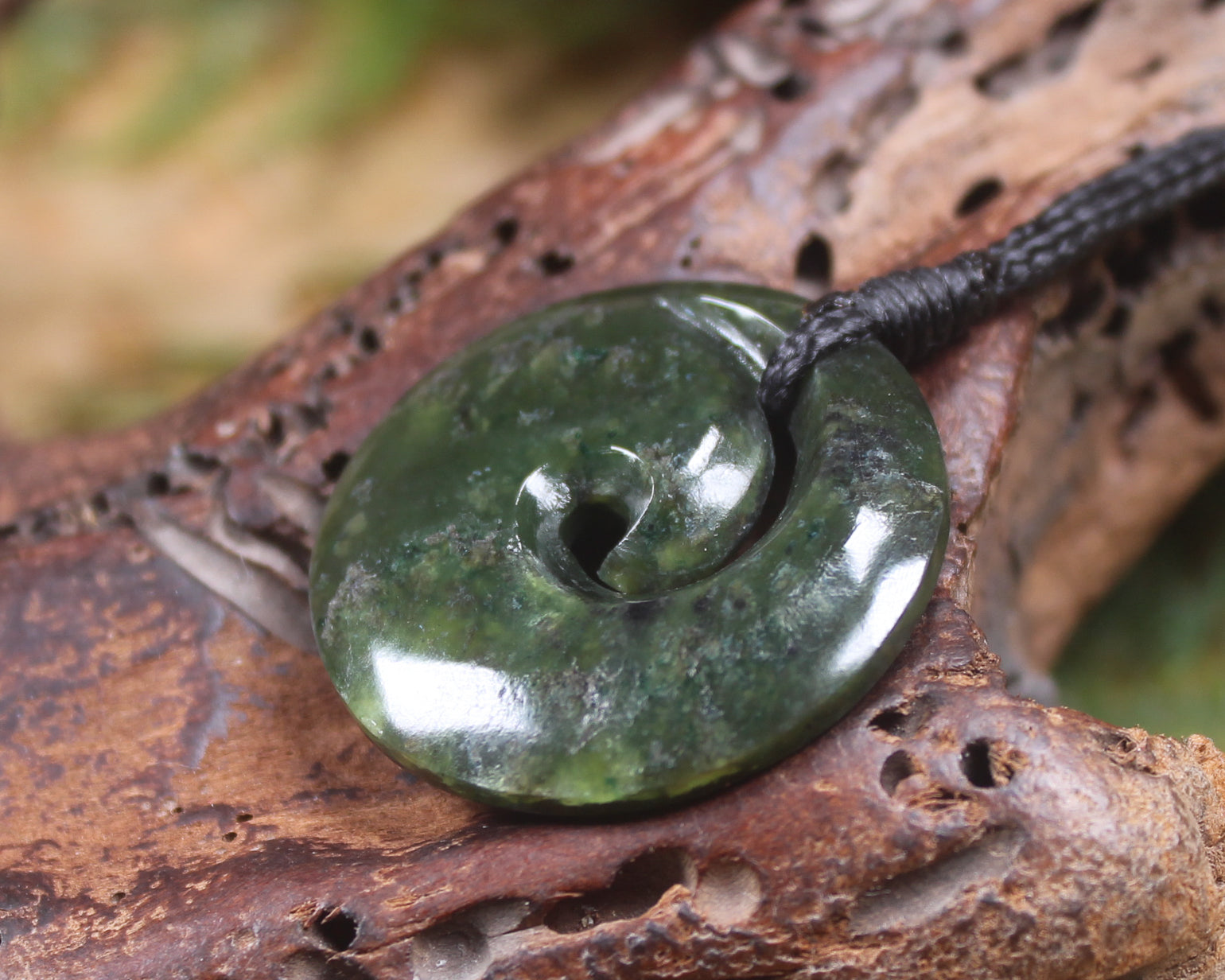 Koru carved from Rimu Pounamu - NZ Greenstone