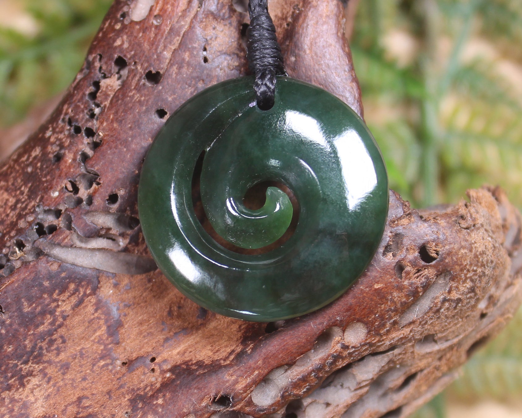 Koru pendant carved from Kawakawa Pounamu - NZ Greenstone