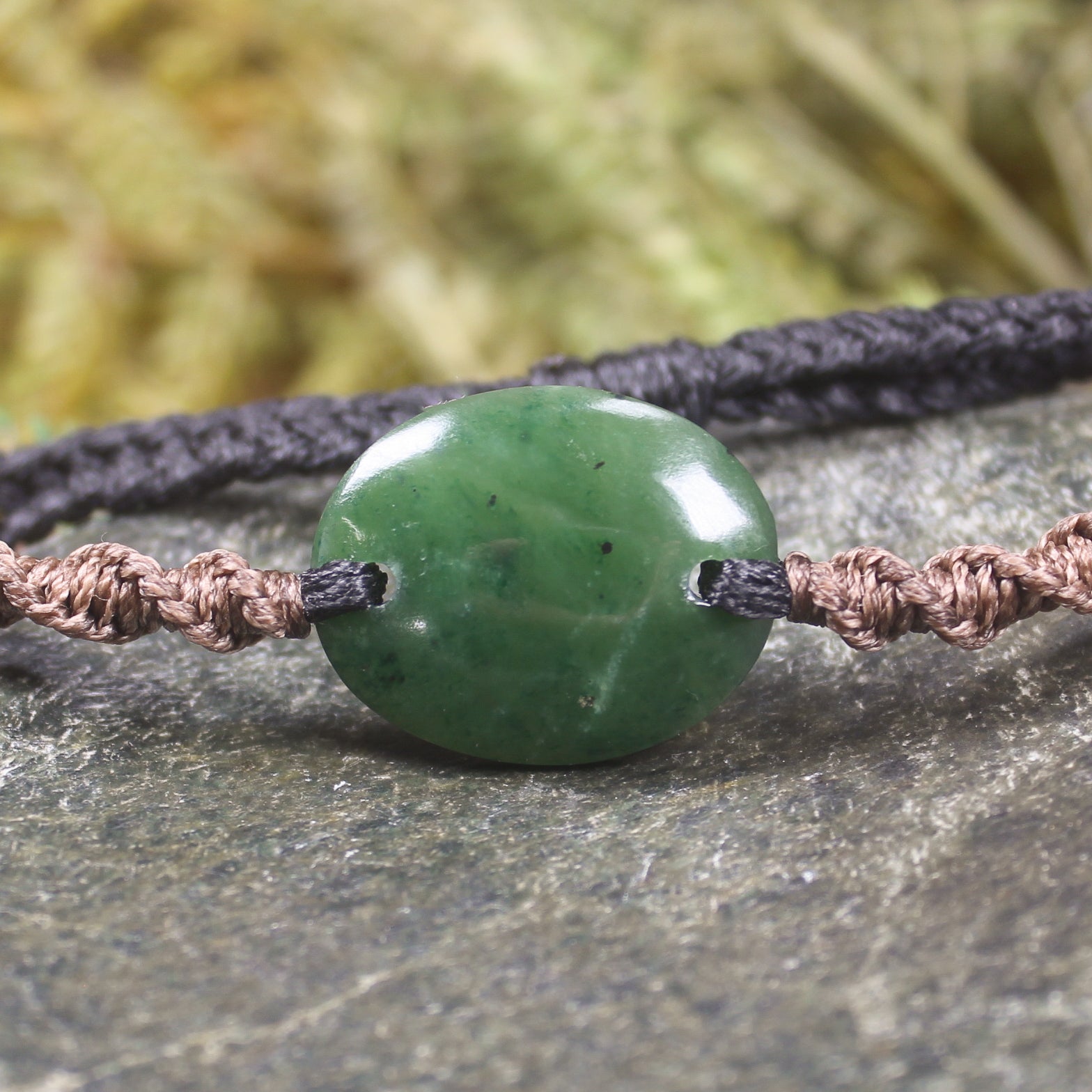 Adjustable cord bracelet with Kawakawa Pounamu
