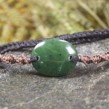 Adjustable cord bracelet with Kawakawa Pounamu