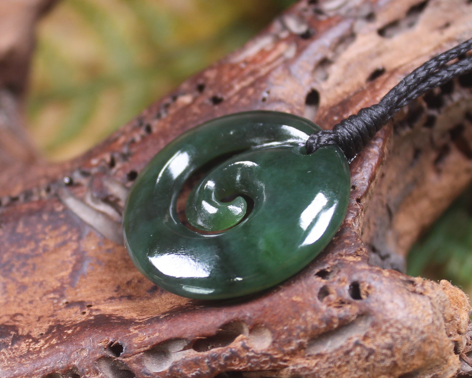 Koru pendant carved from Kawakawa Pounamu - NZ Greenstone