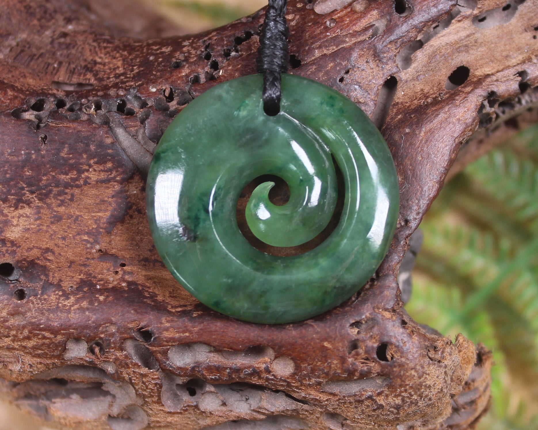 Koru pendant carved from Kawakawa Pounamu - NZ Greenstone