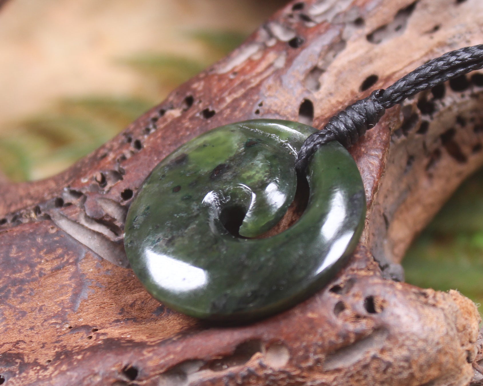 Koru carved from Rimu Pounamu - NZ Greenstone