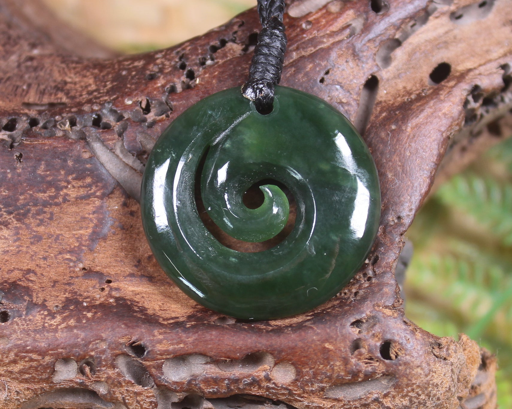 Koru pendant carved from Kawakawa Pounamu - NZ Greenstone