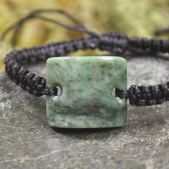 Adjustable cord bracelet with Hapopo Pounamu