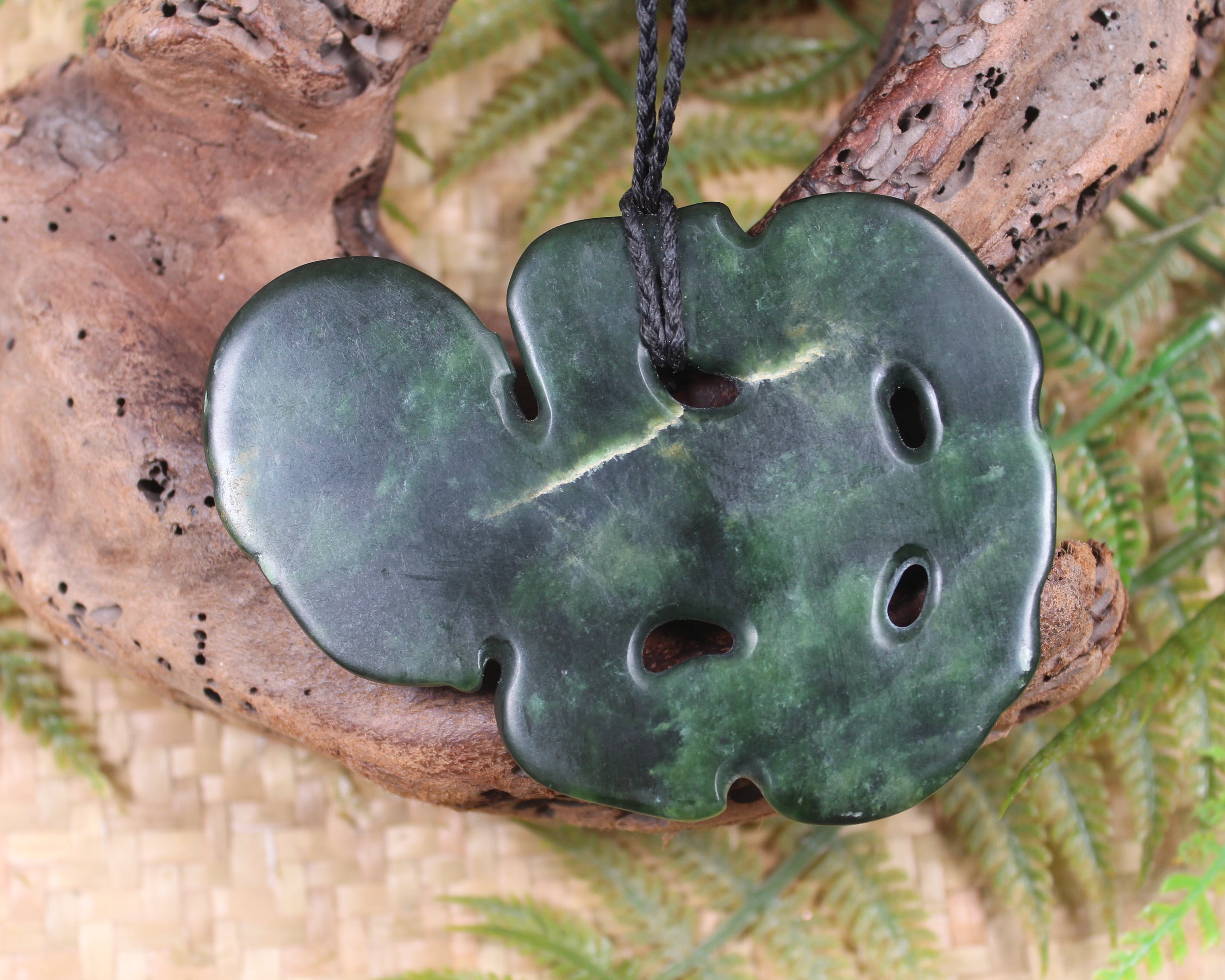 Hei Tiki carved from Flower Jade Pounamu - NZ Greenstone