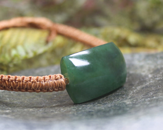 Adjustable cord bracelet with Hapopo Pounamu