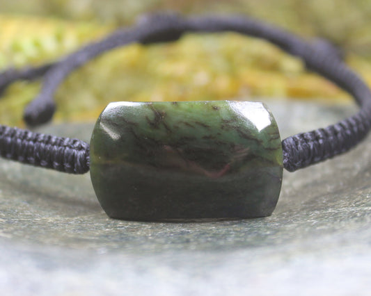 Adjustable cord bracelet with Rimu Pounamu