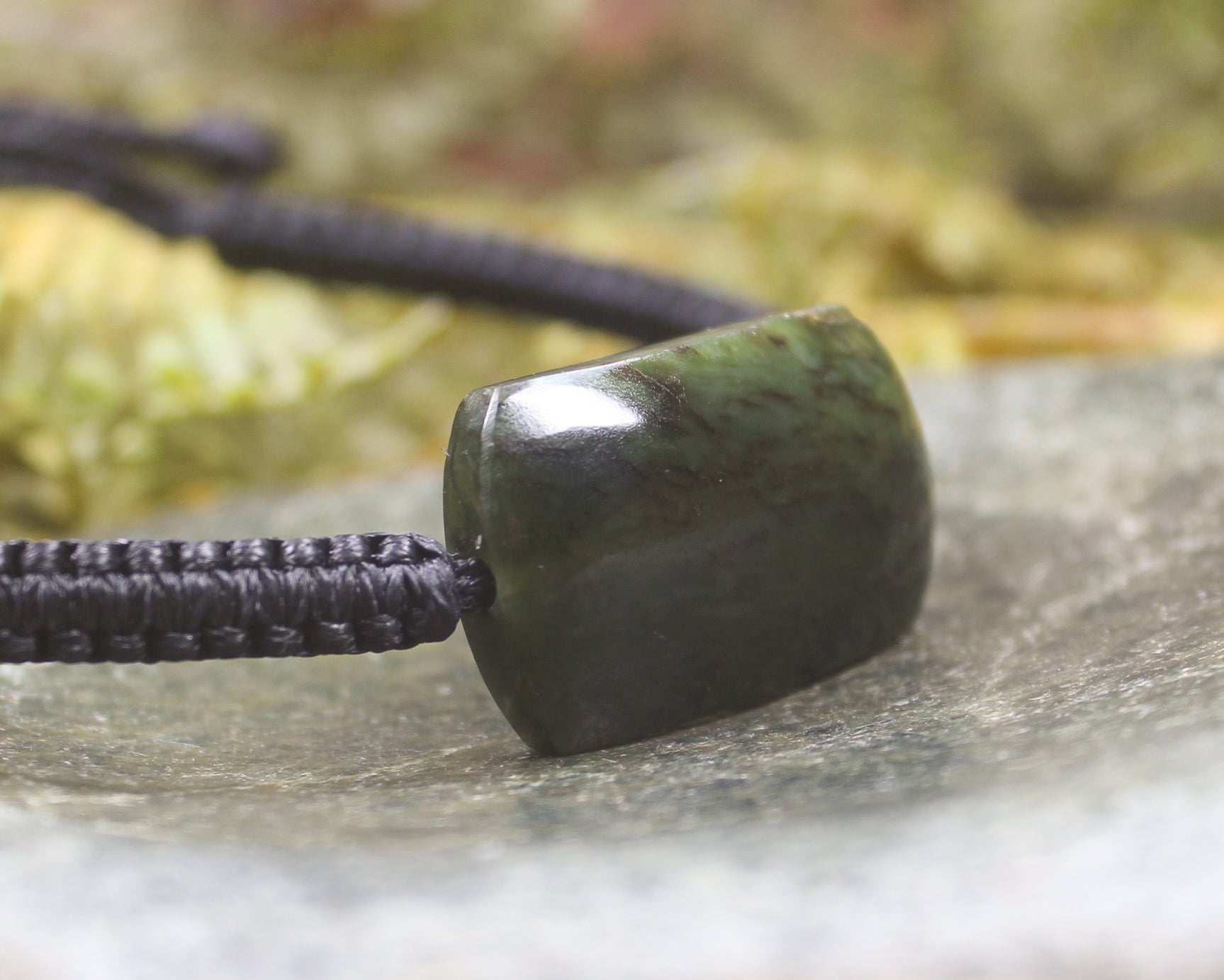 Adjustable cord bracelet with Rimu Pounamu