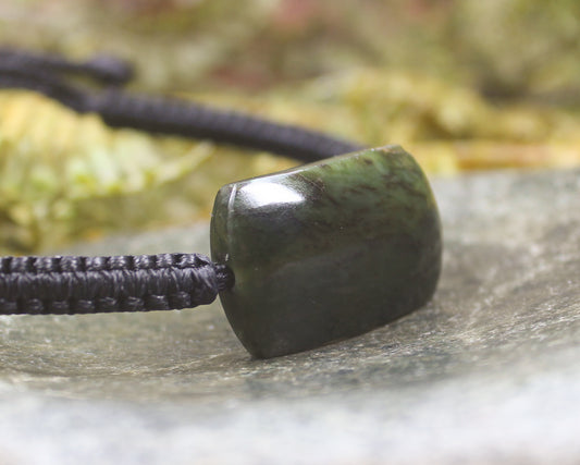 Adjustable cord bracelet with Rimu Pounamu