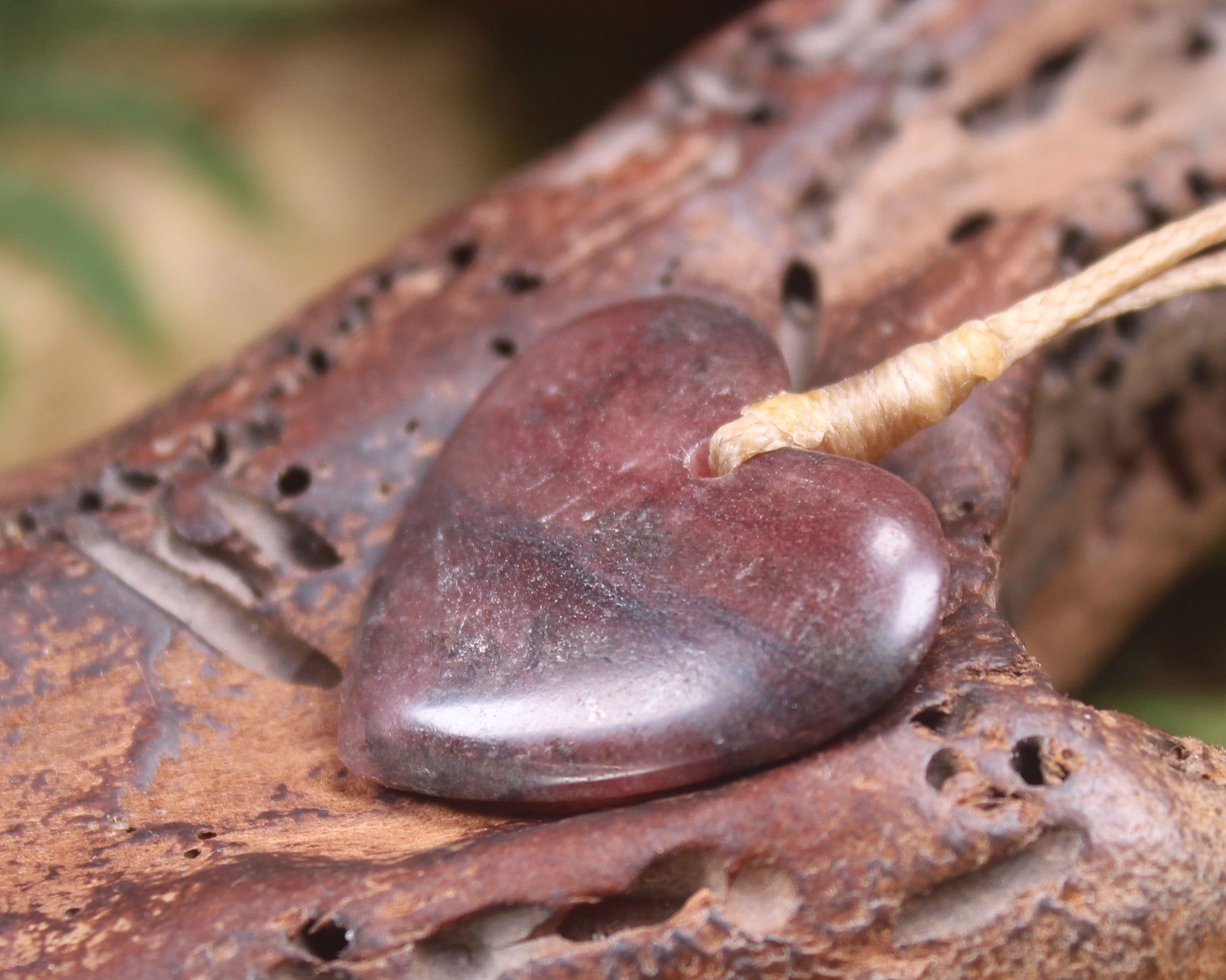 Heart carved from Rhodonite 