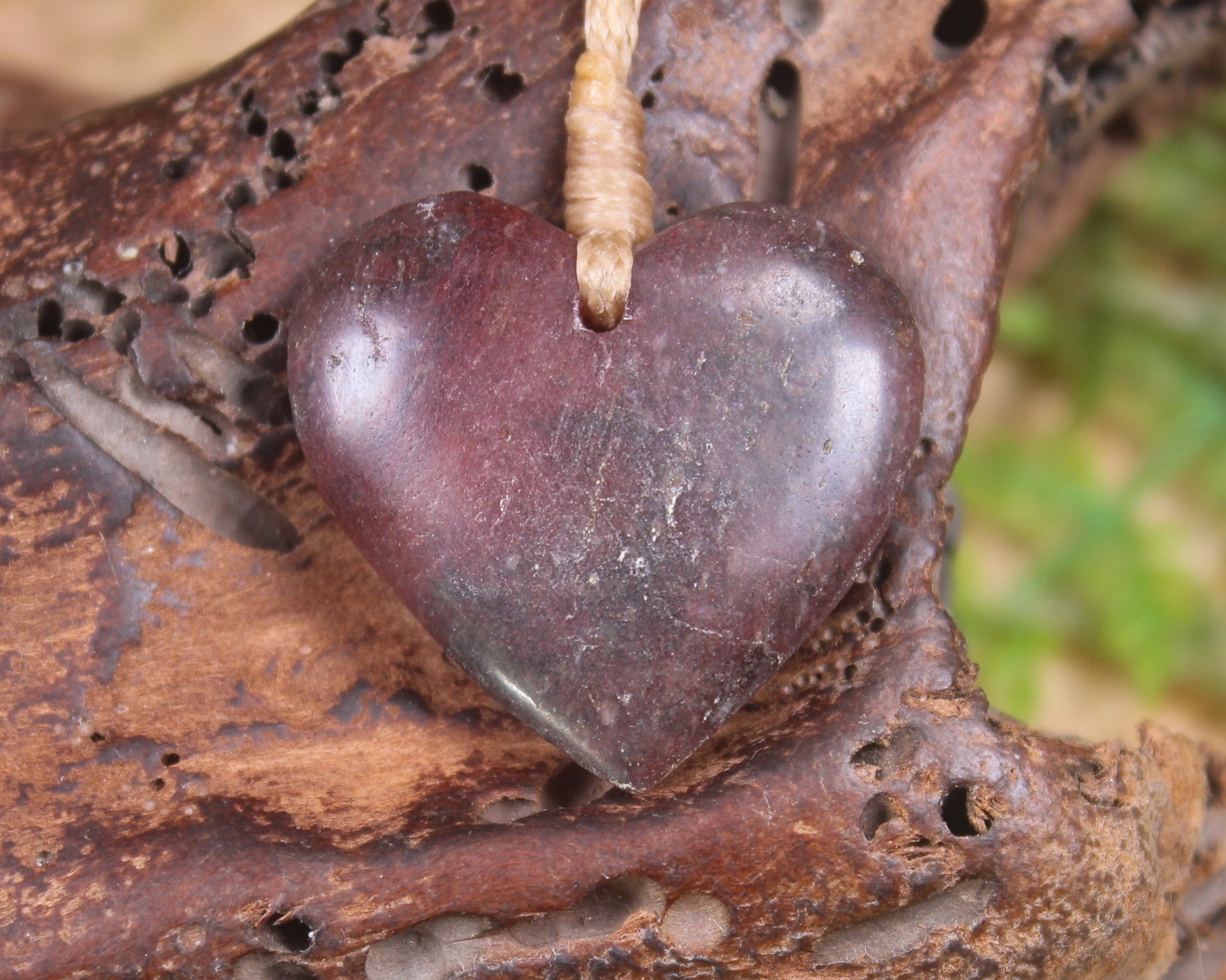 Heart carved from Rhodonite 