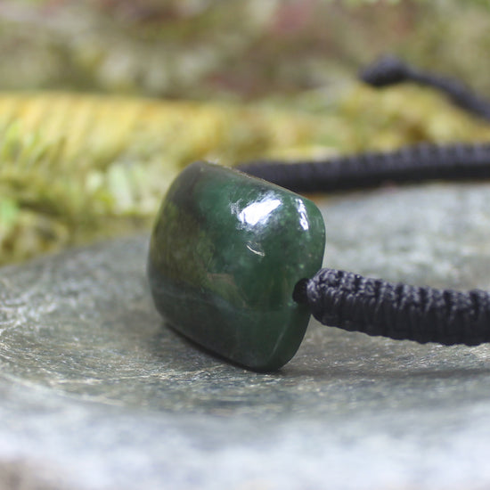 Adjustable cord bracelet with Rimu Pounamu